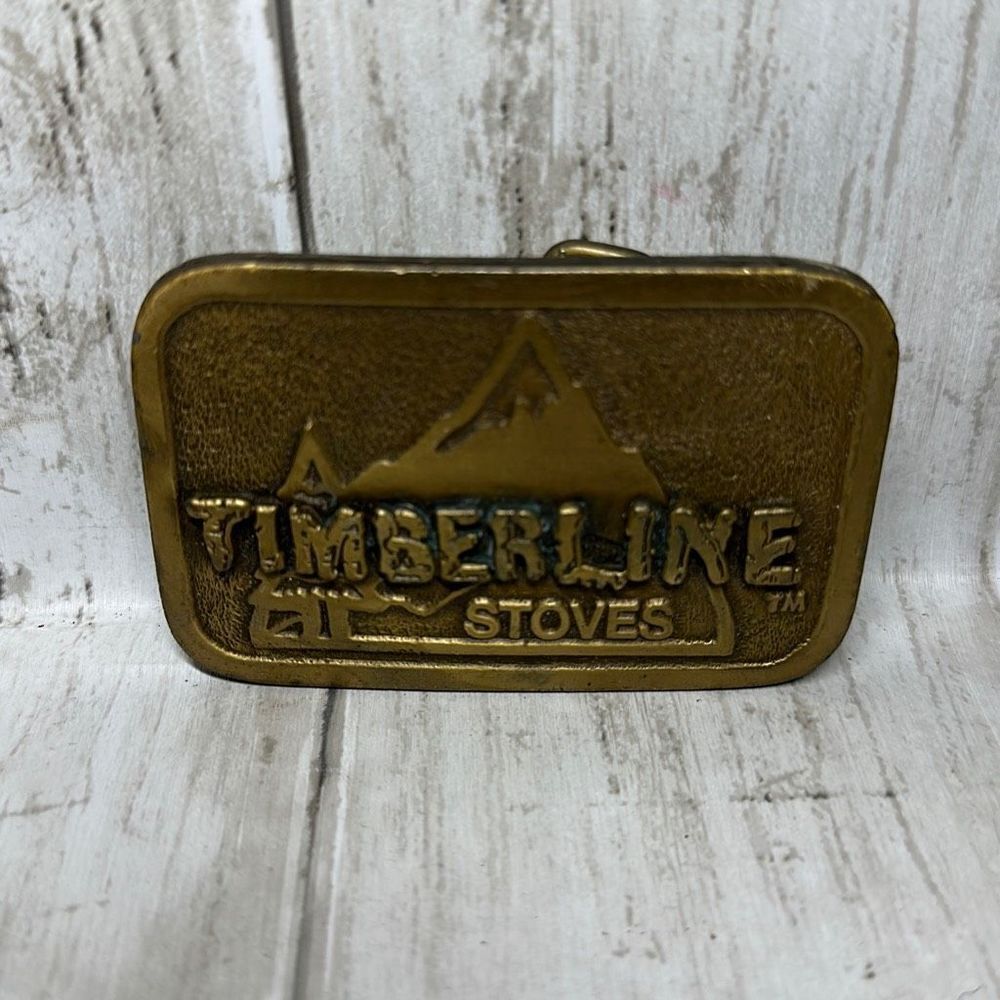 Timberline Stoves Raised Mountain Design Gold Colored Belt Buckle Hit Line USA
